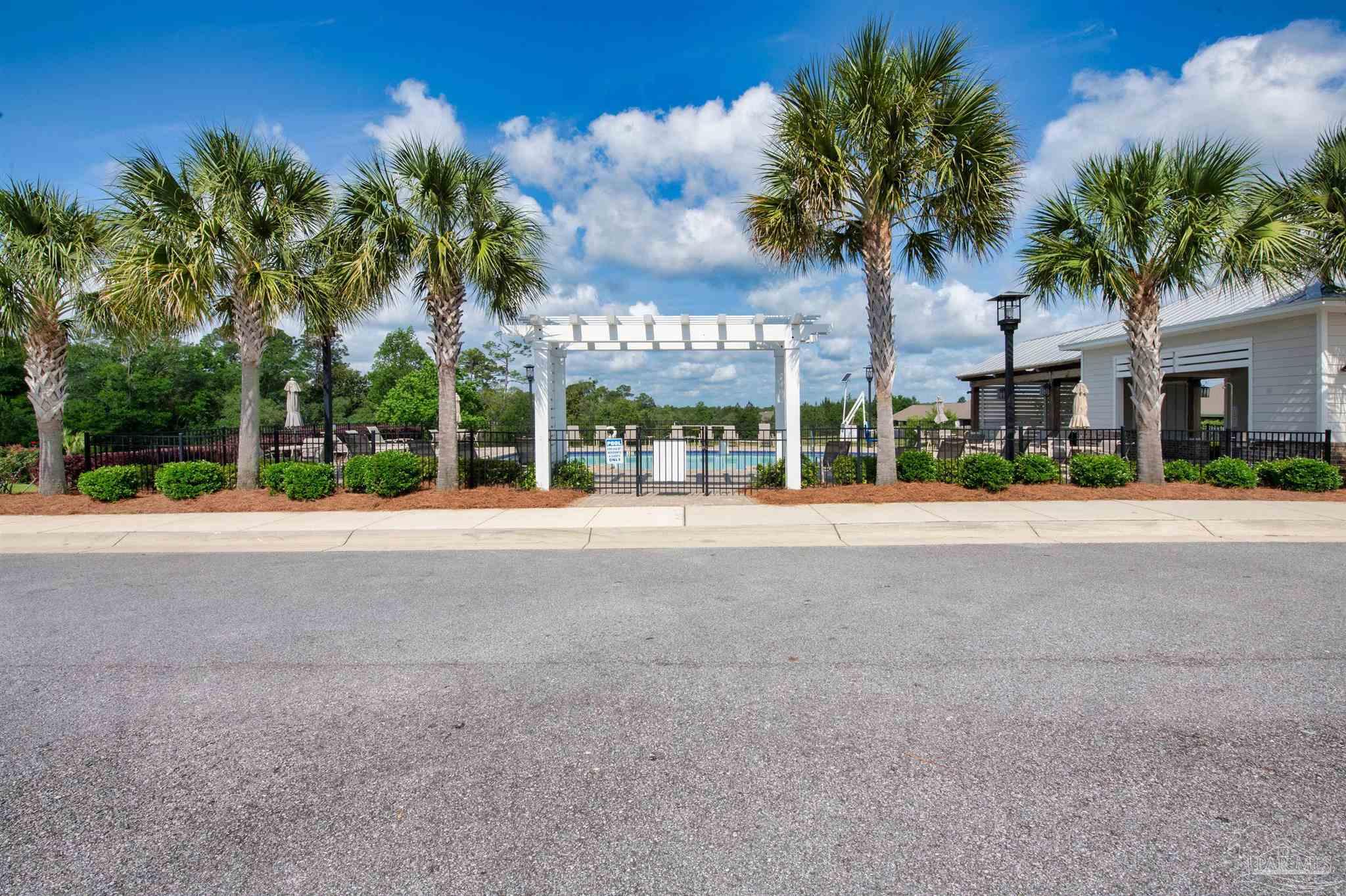 7814 Burnside Loop Pensacola, FL 32526 - Photo 2 of 41 a view of road with palm trees