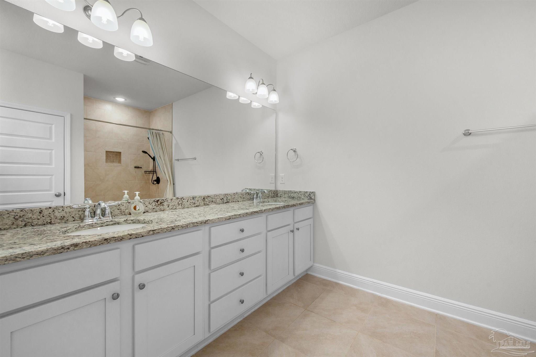 7814 Burnside Loop Pensacola, FL 32526 - Photo 33 of 41 a bathroom with a granite countertop double vanity sink and a mirror