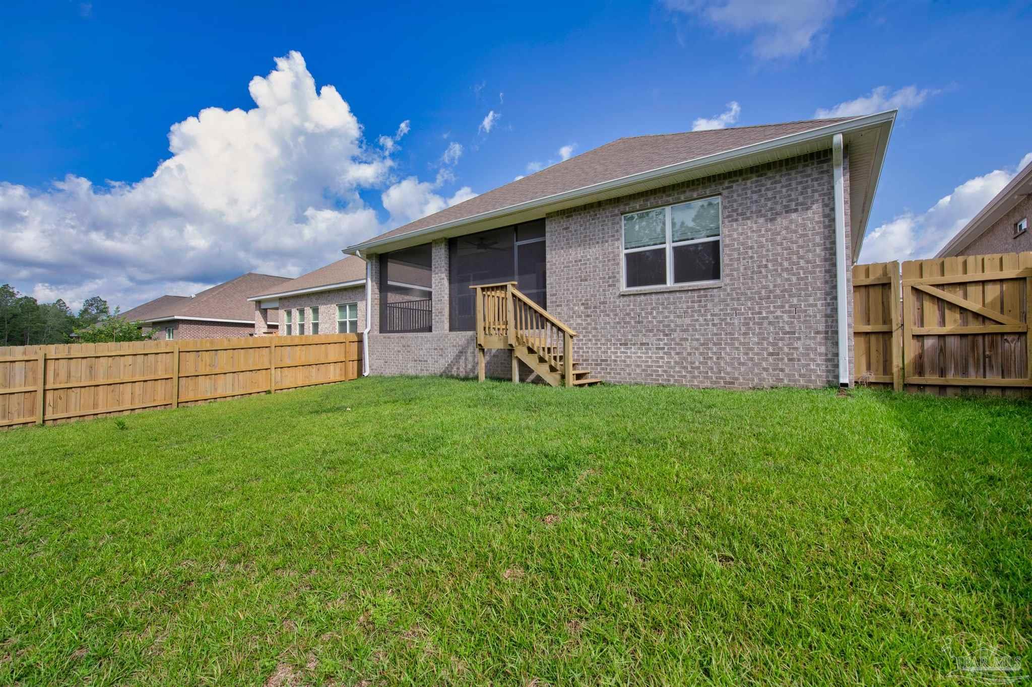 7814 Burnside Loop Pensacola, FL 32526 - Photo 39 of 41 a view of a house with a yard and sitting area