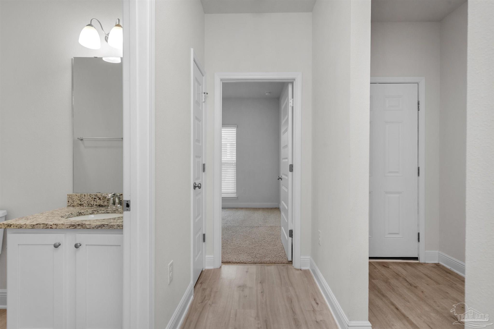 7814 Burnside Loop Pensacola, FL 32526 - Photo 8 of 41 a view of a bathroom from the hallway