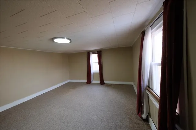 a view of empty room with windows