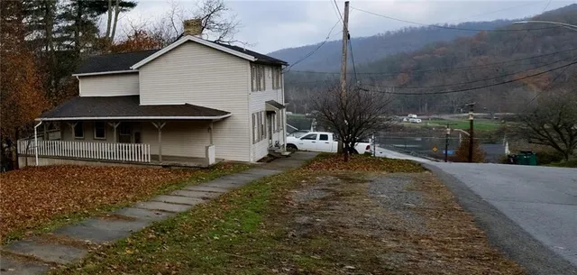 a view of house with outdoor space