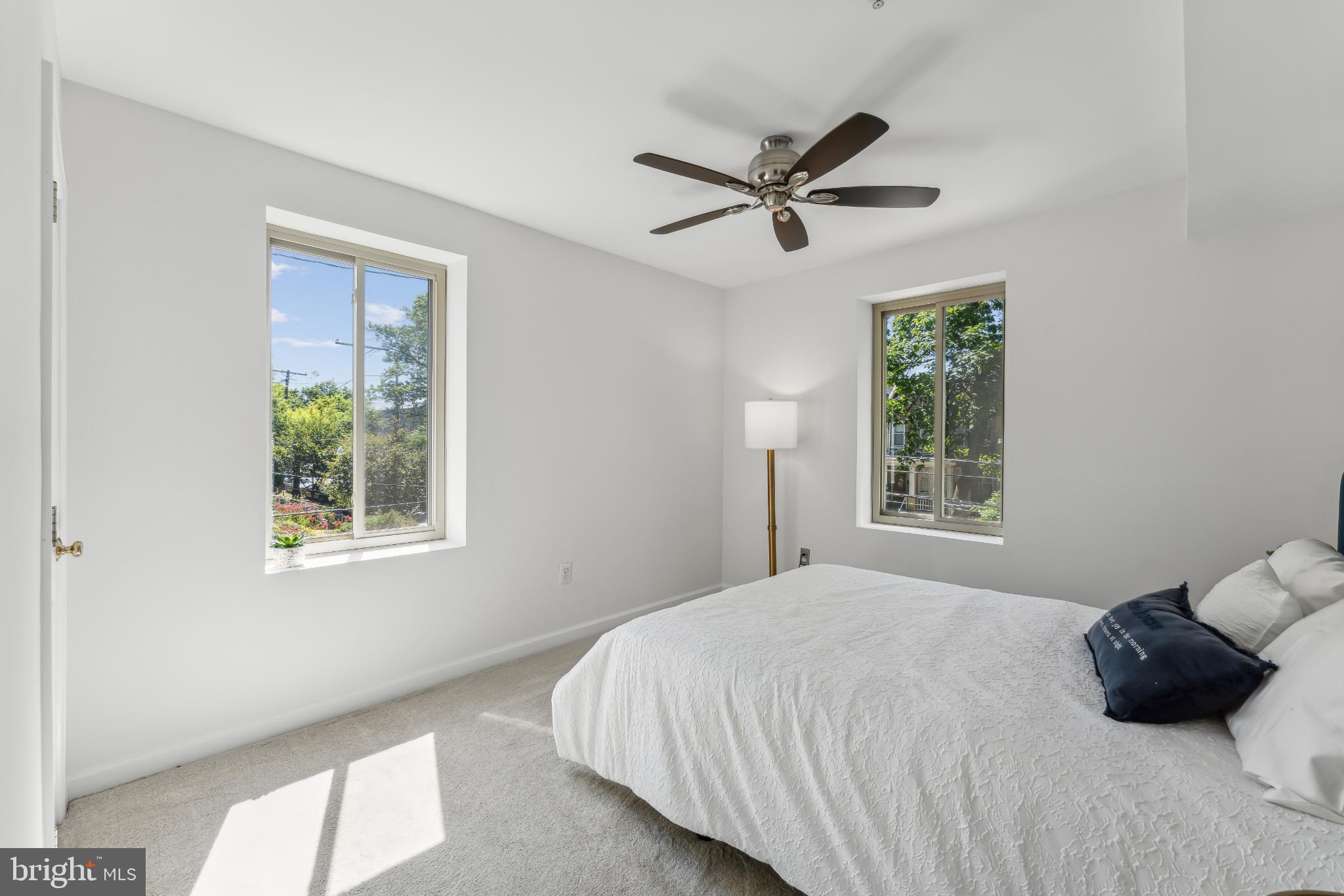 5403 9th Street Northwest, Unit 204 Washington, DC 20011 - Photo 13 of 19 a bedroom with a bed and a window
