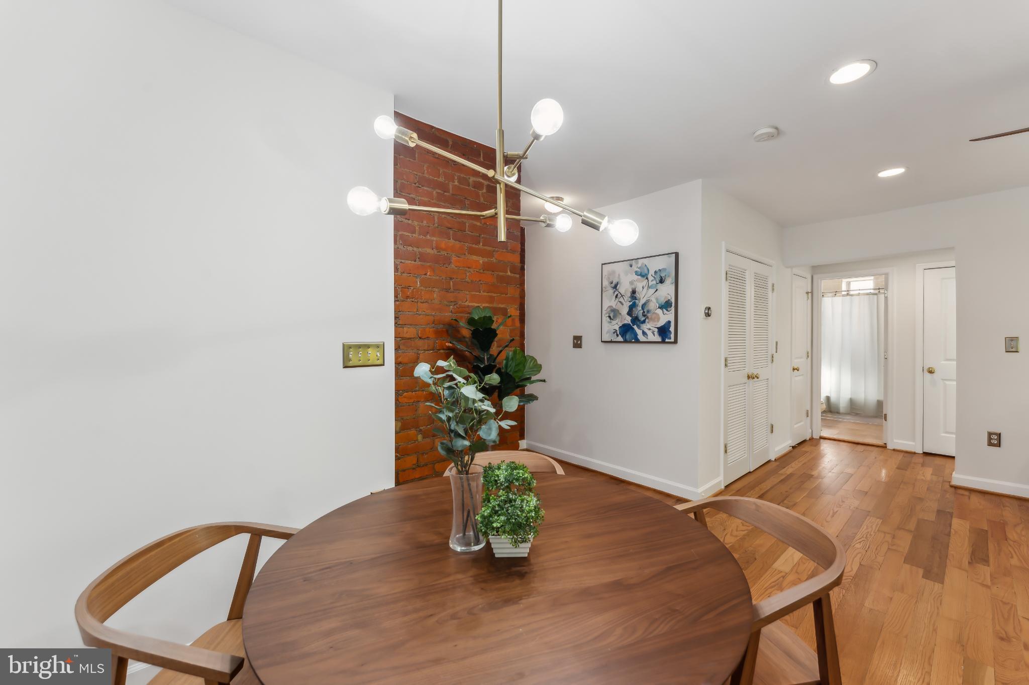 5403 9th Street Northwest, Unit 204 Washington, DC 20011 - Photo 8 of 19 a room with furniture and wooden floor