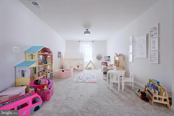a bedroom with furniture toys and a baby crib