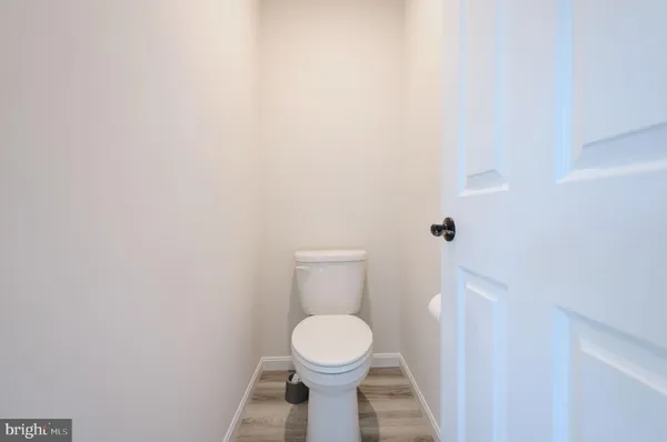 a bathroom with a toilet and a sink