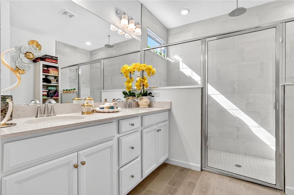 7507 Southwest 76th Terrace Ocala, FL 34476 - Photo 12 of 22 a bathroom with a sink mirror and vanity