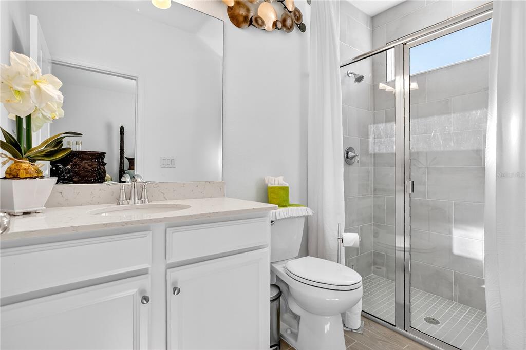 7507 Southwest 76th Terrace Ocala, FL 34476 - Photo 15 of 22 a bathroom with a sink toilet and shower