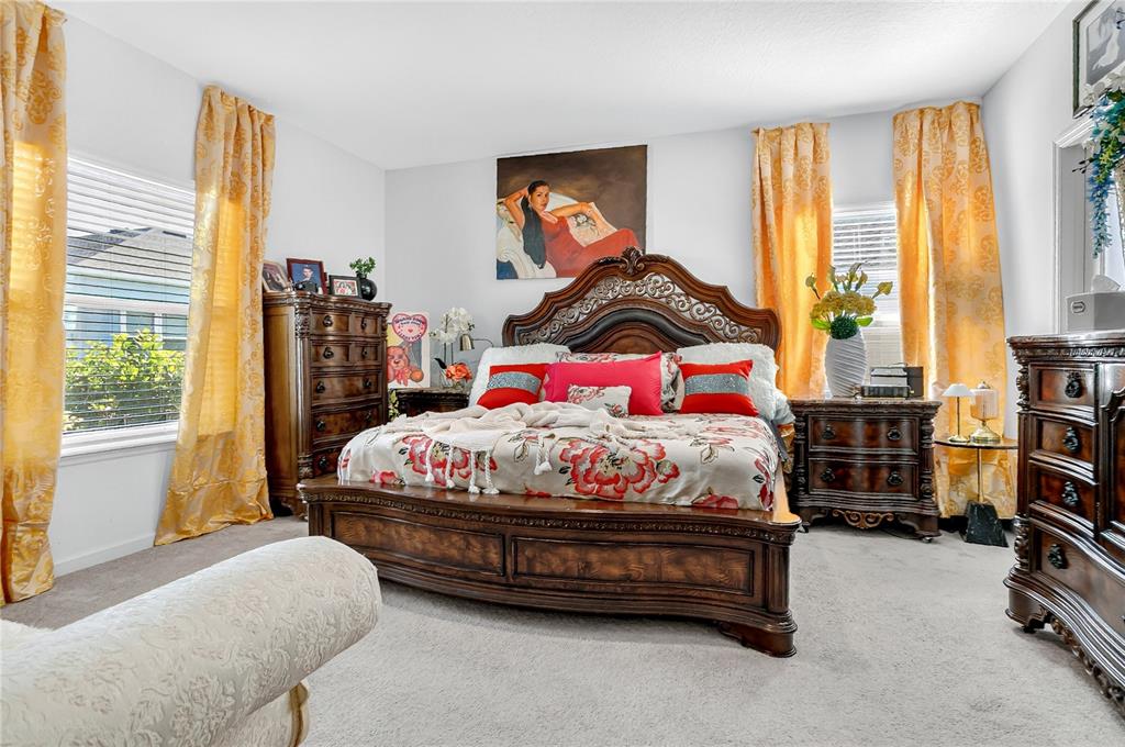 7507 Southwest 76th Terrace Ocala, FL 34476 - Photo 10 of 22 a bedroom with a bed and window