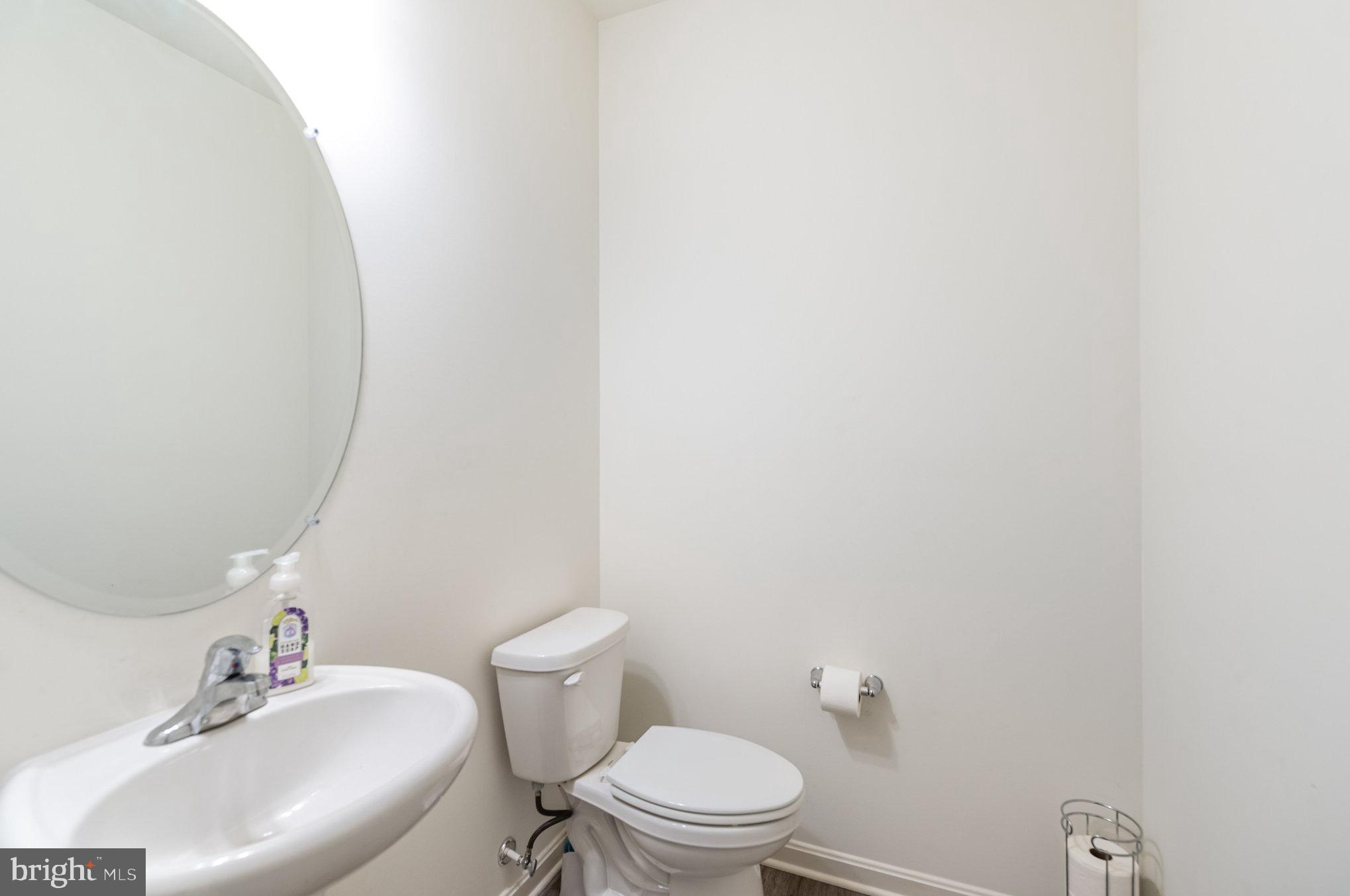 105 Maple Leaf Drive Rising Sun, MD 21911 - Photo 12 of 31 a bathroom with a sink a toilet and a mirror
