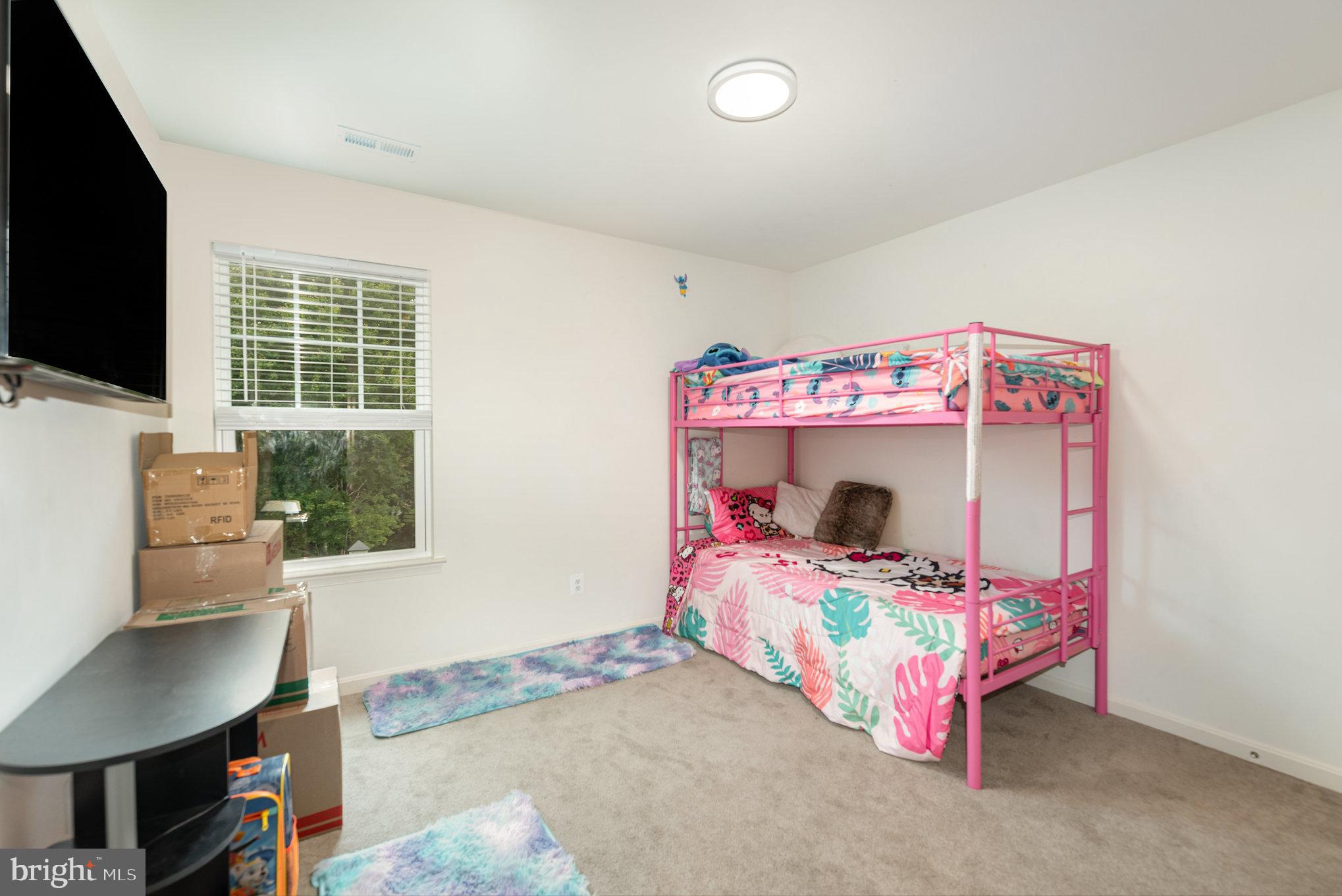 105 Maple Leaf Drive Rising Sun, MD 21911 - Photo 19 of 31 a bedroom with a bed and a window
