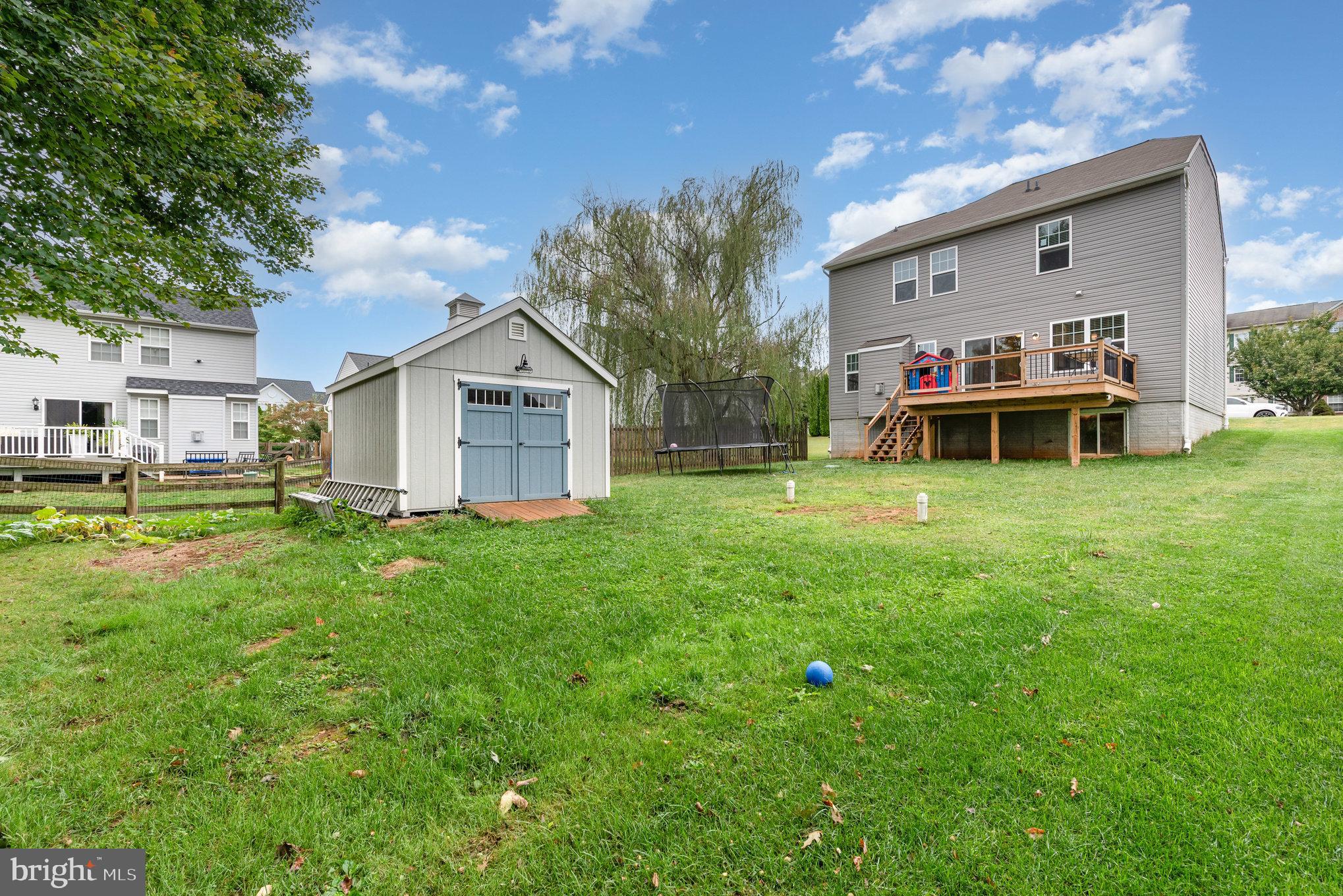 105 Maple Leaf Drive Rising Sun, MD 21911 - Photo 24 of 31 a view of a white house with a big yard and large trees