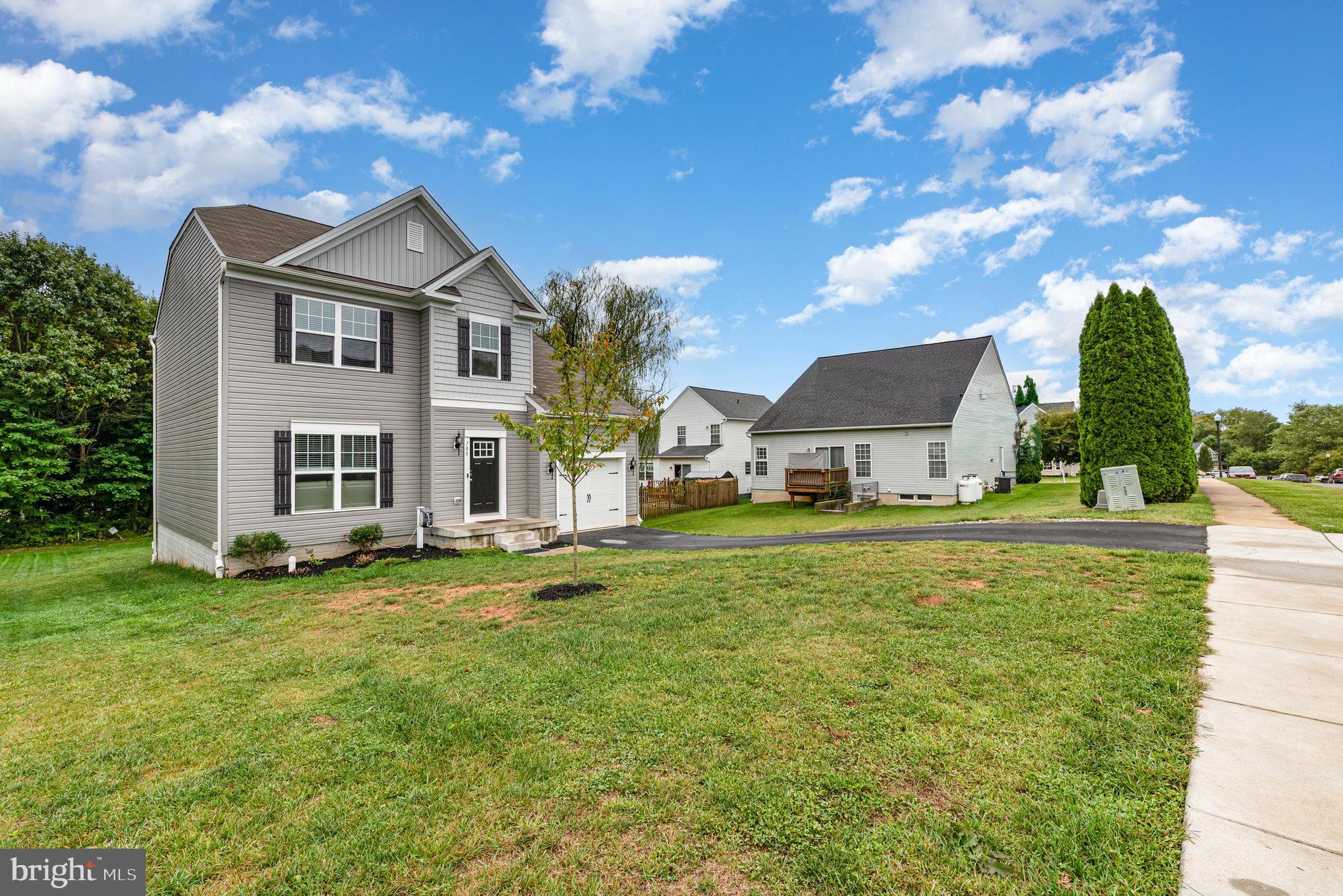 105 Maple Leaf Drive Rising Sun, MD 21911 - Photo 29 of 31 a front view of a house with a garden