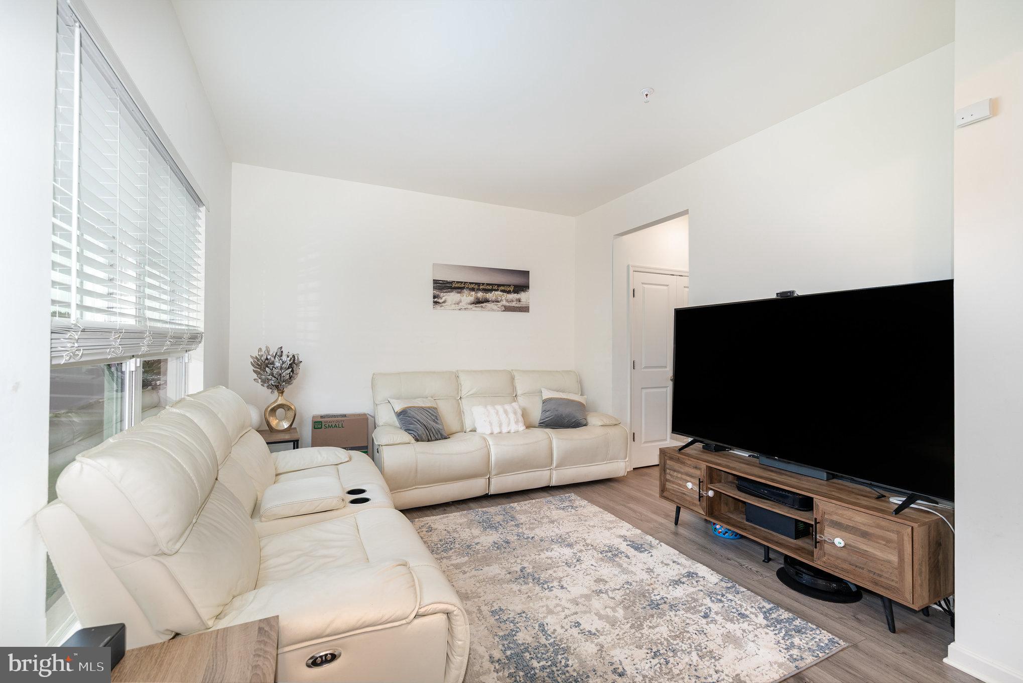 105 Maple Leaf Drive Rising Sun, MD 21911 - Photo 5 of 31 a living room with furniture and a flat screen tv