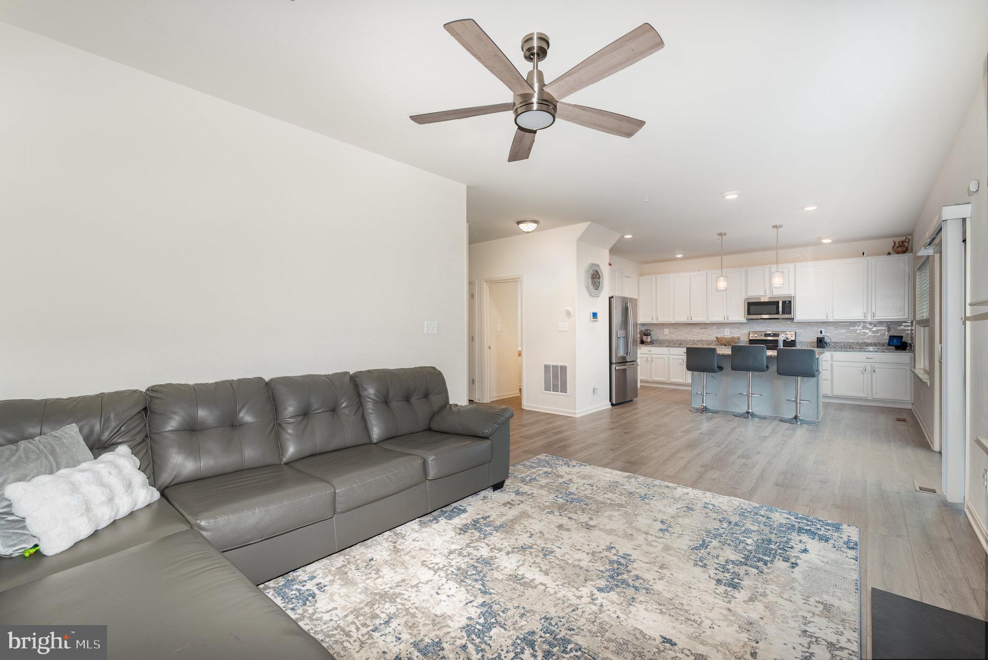 105 Maple Leaf Drive Rising Sun, MD 21911 - Photo 7 of 31 a living room with furniture and kitchen view