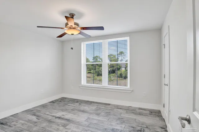 a view of a bench in the garden near a lake