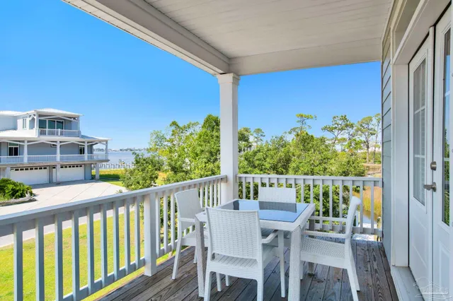 a view of a chairs and table in patio
