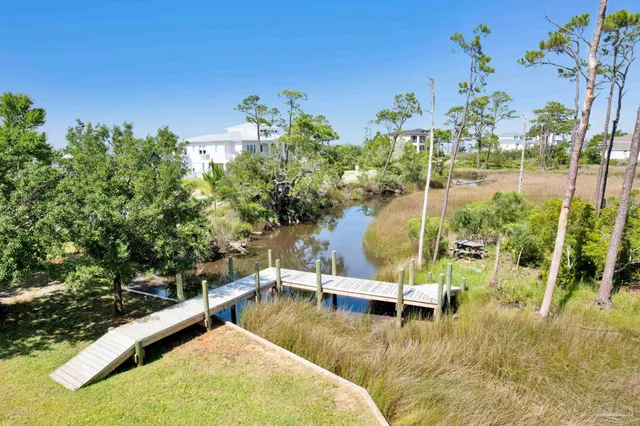 a view of swimming pool with outdoor seating