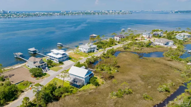 an aerial view of a house with a lake view