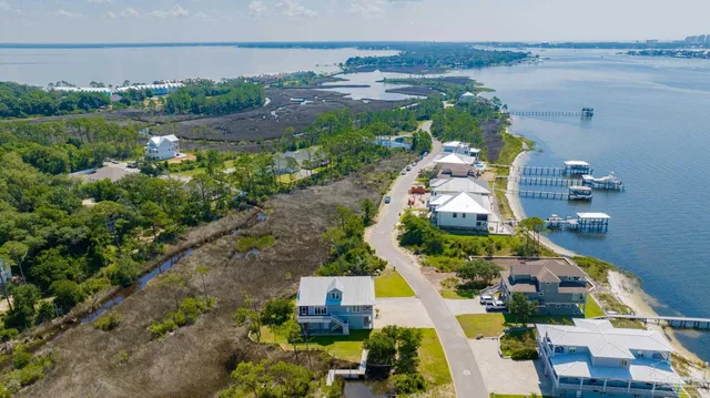 a front view of a house with a yard table and chairs