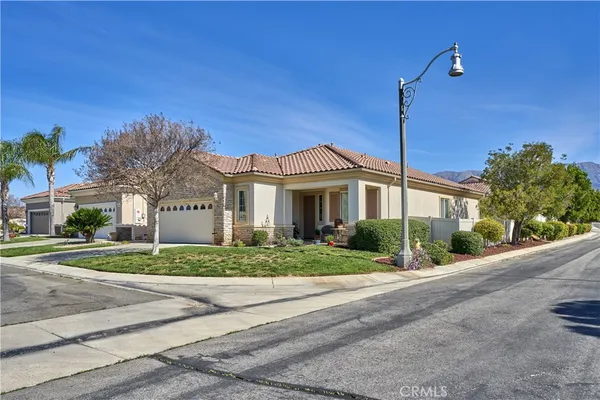 a living room with furniture a flat screen tv and a large window