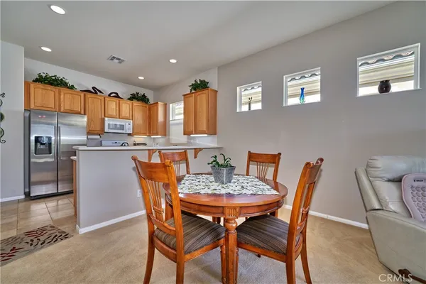 a kitchen with stainless steel appliances a sink stove and cabinets