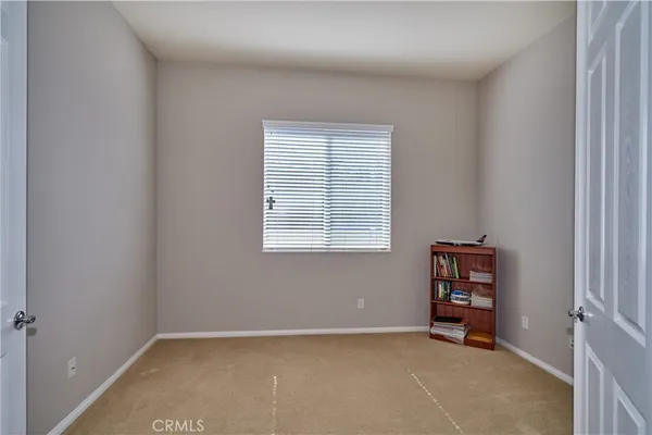 a bathroom with a bathtub sink and mirror