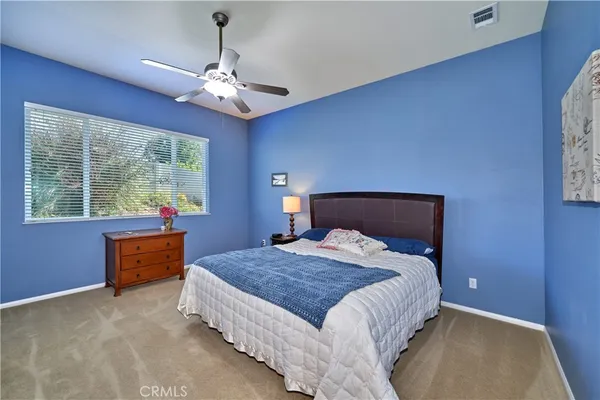 a view of a patio with table and chairs and potted plants
