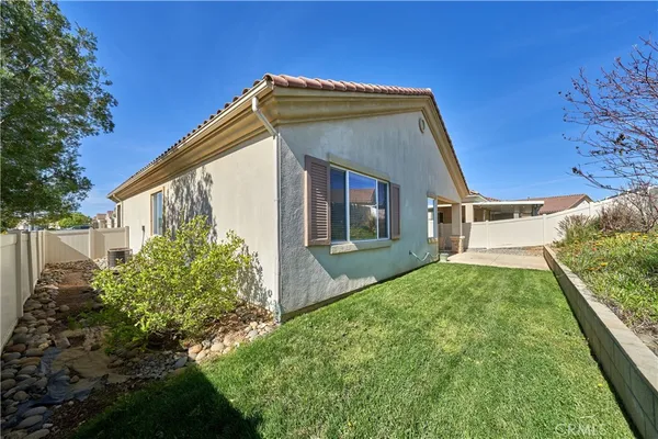 a living room with furniture pool table and a large window
