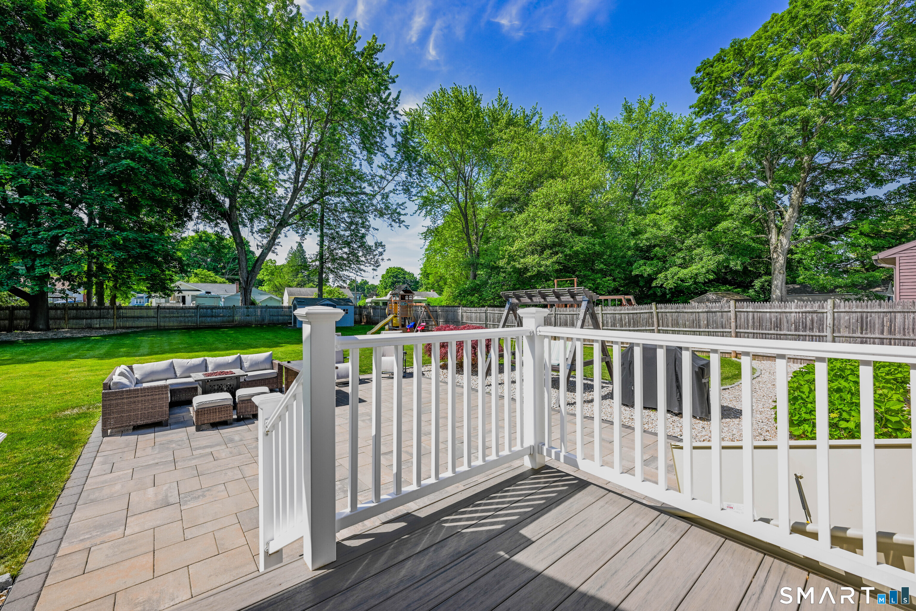 87 Lydall Road Newington, CT 06111 - Photo 24 of 35 a view of a deck with a table and chairs