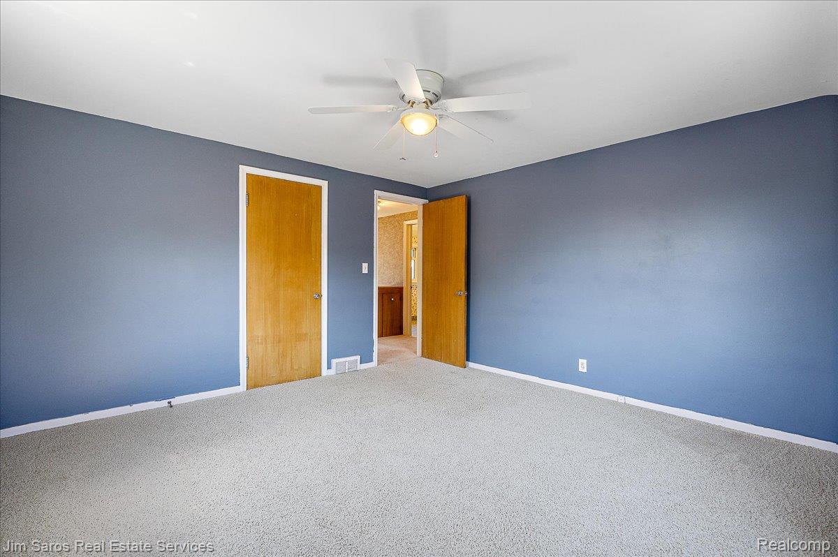 1010 Nottingham Road Grosse Pointe, MI 48230 - Photo 16 of 30 Interior room featuring light-colored carpet flooring and blue painted walls