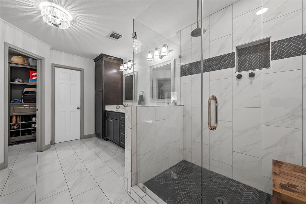 107 South Old Robinson Road Robinson, TX 76706 - Photo 20 of 39 Bathroom featuring vanity, light marble finish floors, and a shower stall