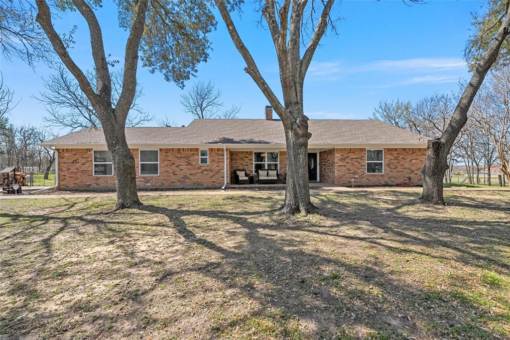 107 South Old Robinson Road Robinson, TX 76706 - Photo 2 of 39 Ranch-style house with brick siding, a shingled roof, and a front yard