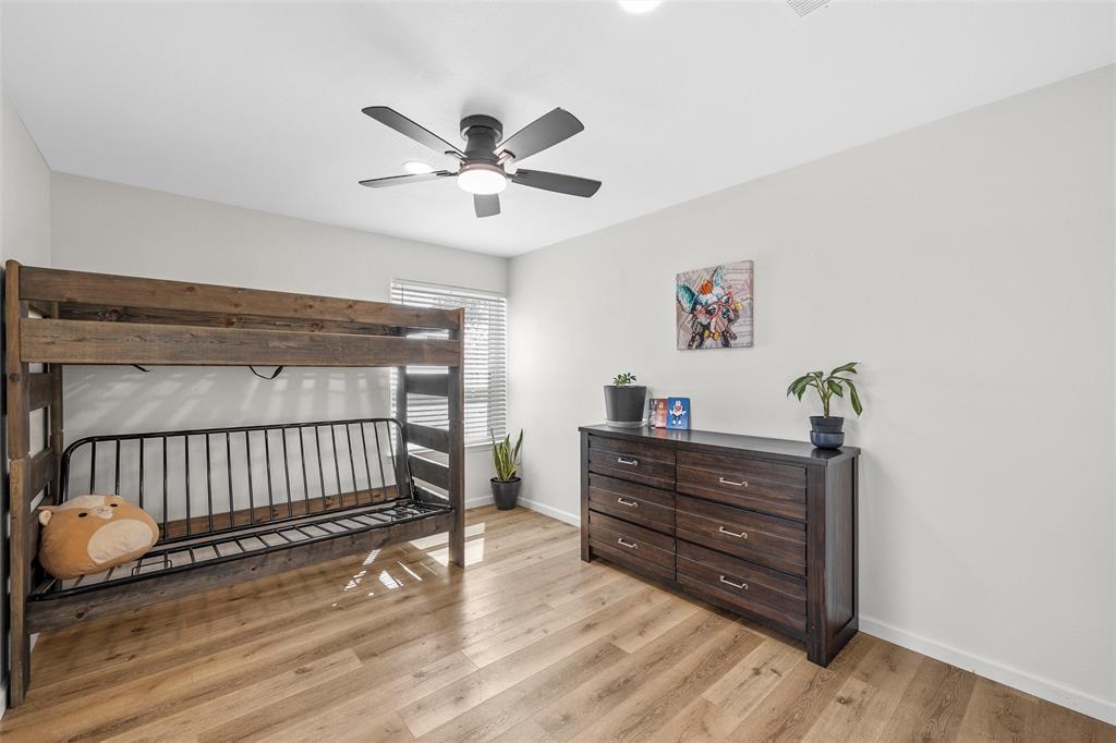 107 South Old Robinson Road Robinson, TX 76706 - Photo 30 of 39 Bedroom featuring light wood finished floors and a ceiling fan