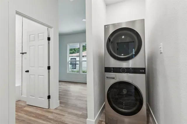 a view of a hallway with washer and dryer