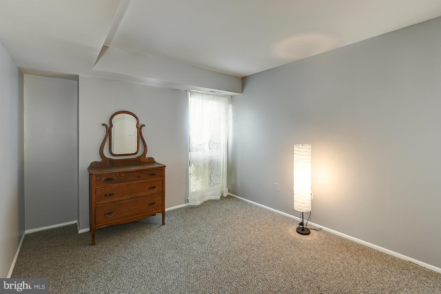 2360 Sun Valley Circle, Unit 2GH Silver Spring, MD 20906 - Photo 15 of 30 an empty room with a fireplace and window