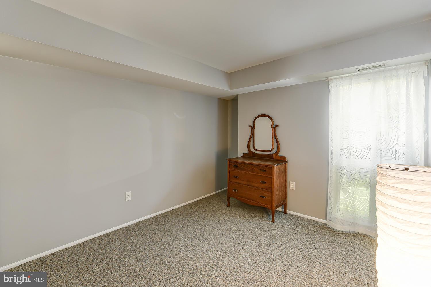 2360 Sun Valley Circle, Unit 2GH Silver Spring, MD 20906 - Photo 17 of 30 a room with a bench and window