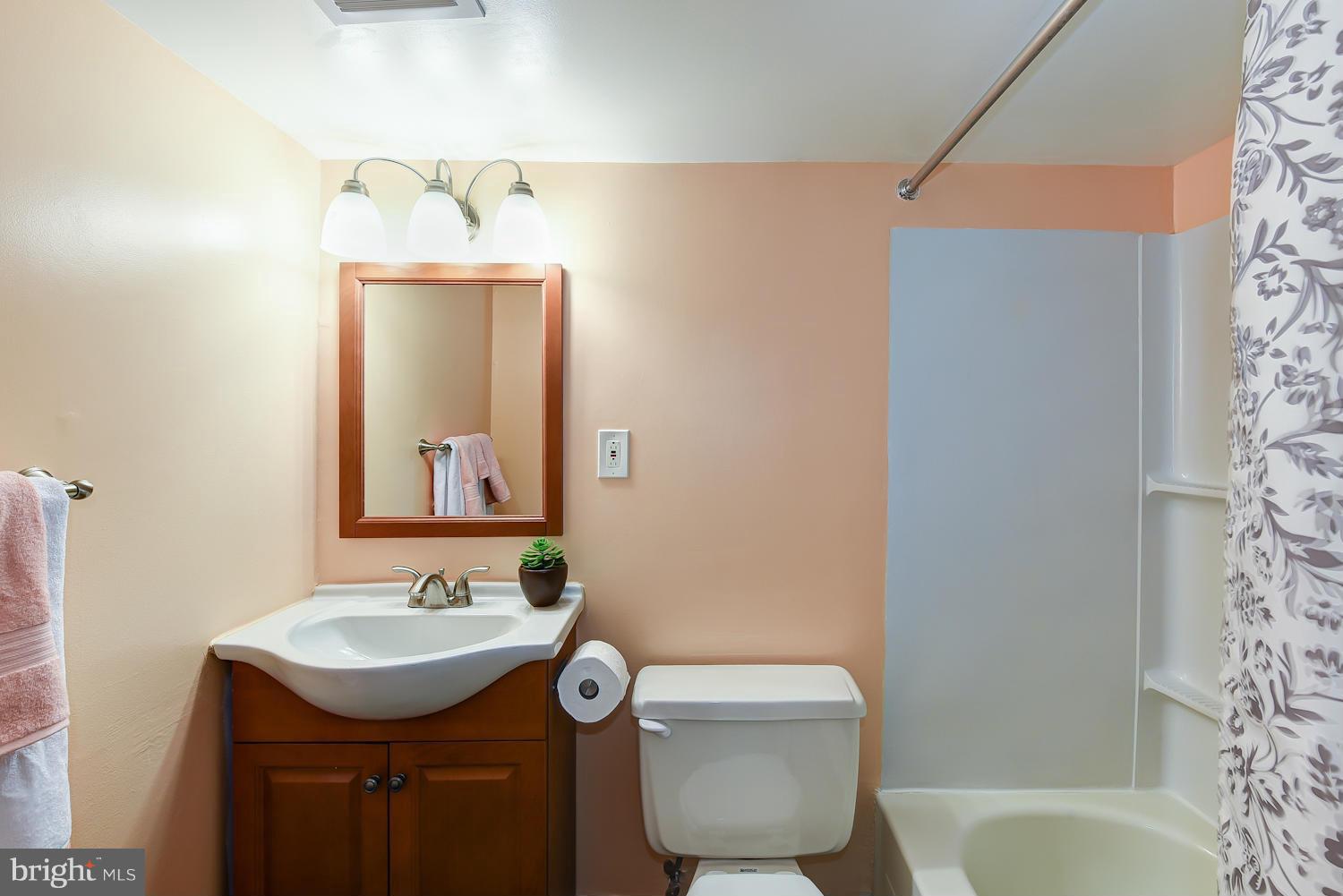 2360 Sun Valley Circle, Unit 2GH Silver Spring, MD 20906 - Photo 18 of 30 a bathroom with a sink toilet and shower