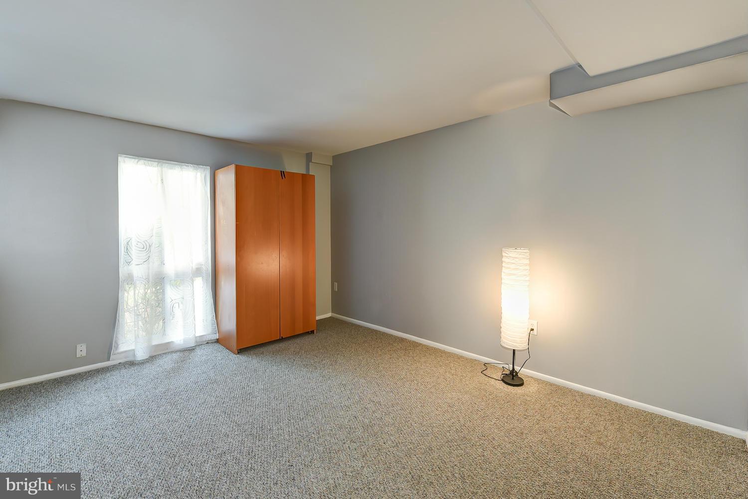 2360 Sun Valley Circle, Unit 2GH Silver Spring, MD 20906 - Photo 19 of 30 an empty room with a empty space and windows