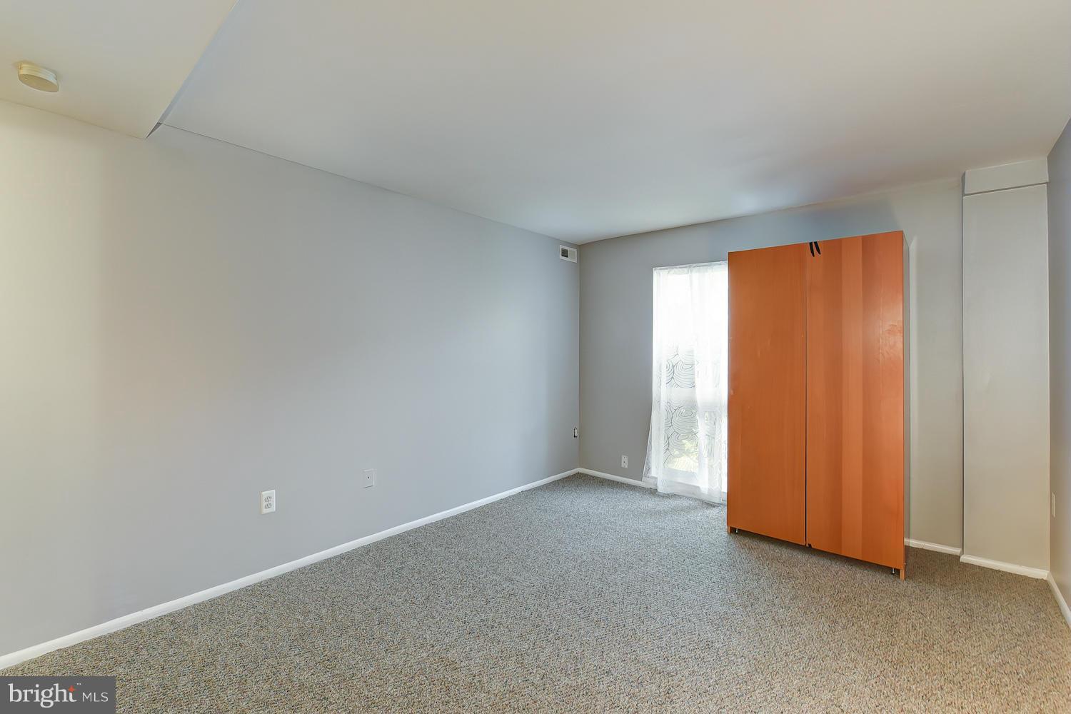 2360 Sun Valley Circle, Unit 2GH Silver Spring, MD 20906 - Photo 23 of 30 a view of an empty room and a window