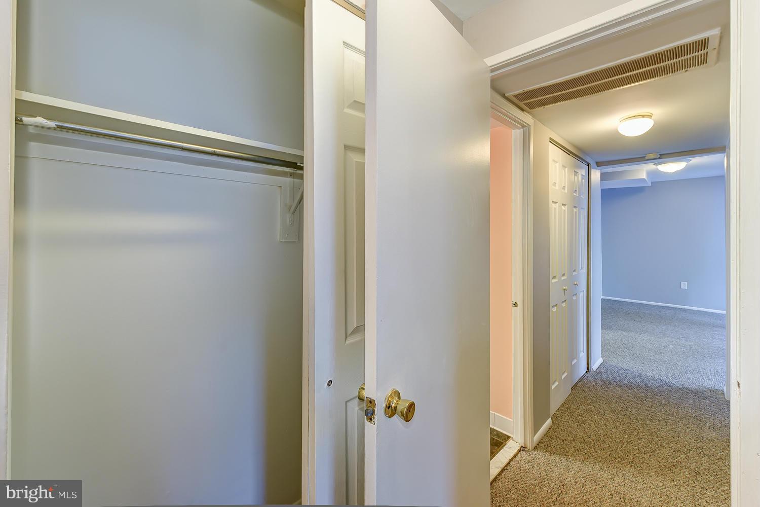 2360 Sun Valley Circle, Unit 2GH Silver Spring, MD 20906 - Photo 24 of 30 a view of a hallway with wooden floor and closet