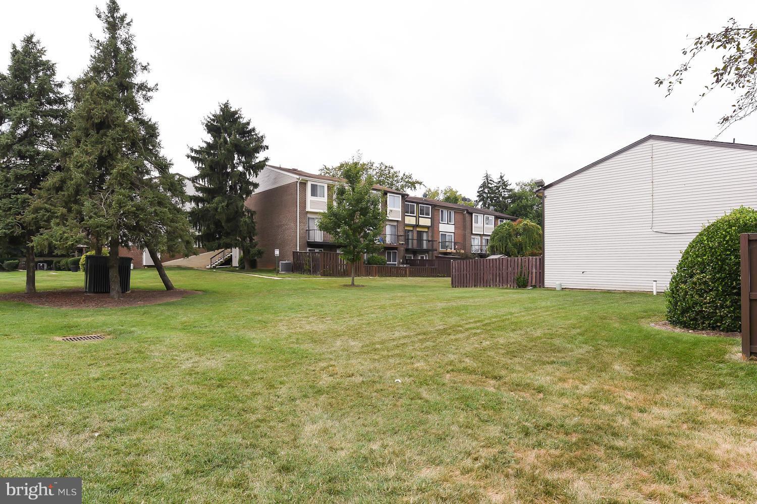2360 Sun Valley Circle, Unit 2GH Silver Spring, MD 20906 - Photo 27 of 30 a view of a backyard with large trees