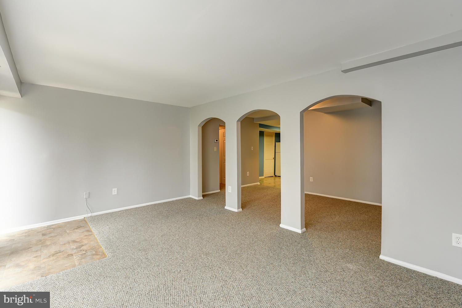 2360 Sun Valley Circle, Unit 2GH Silver Spring, MD 20906 - Photo 5 of 30 an empty room with windows