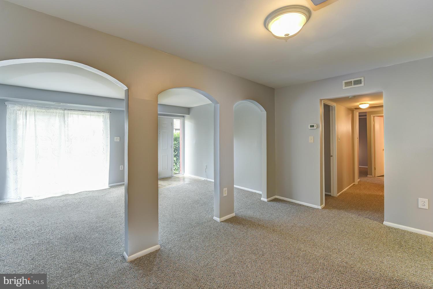 2360 Sun Valley Circle, Unit 2GH Silver Spring, MD 20906 - Photo 9 of 30 an empty room with windows and closet