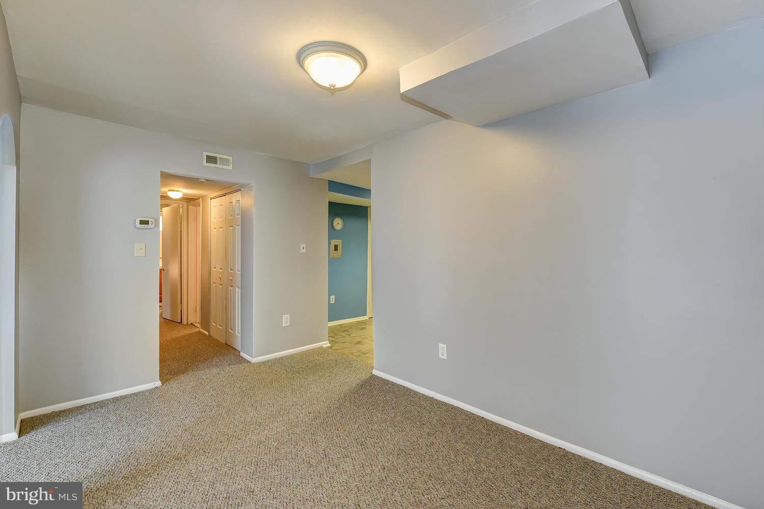 2360 Sun Valley Circle, Unit 2GH Silver Spring, MD 20906 - Photo 10 of 30 an empty room with windows and bathroom view