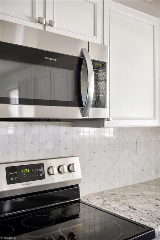 3025 Hickory Tree Road Winston-Salem, NC 27127 - Photo 20 of 33 Love the look of the kitchen with the SS Appliances. tile and granite! Gorgeous!