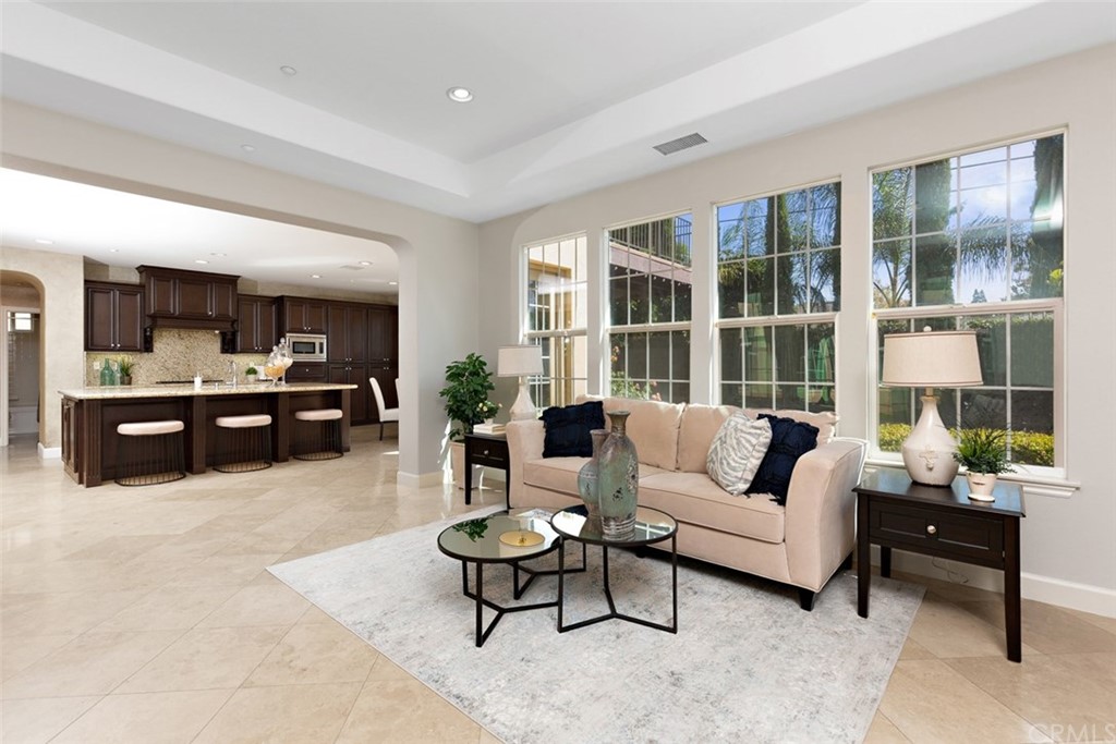 720 West Aster Place Santa Ana, CA 92706 - Photo 12 of 41 a living room with furniture and large windows