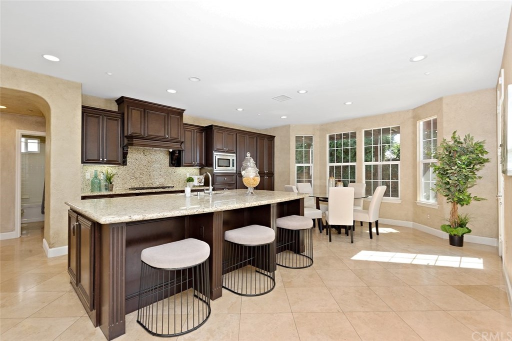 720 West Aster Place Santa Ana, CA 92706 - Photo 2 of 41 a dining room with furniture and a floor to ceiling window