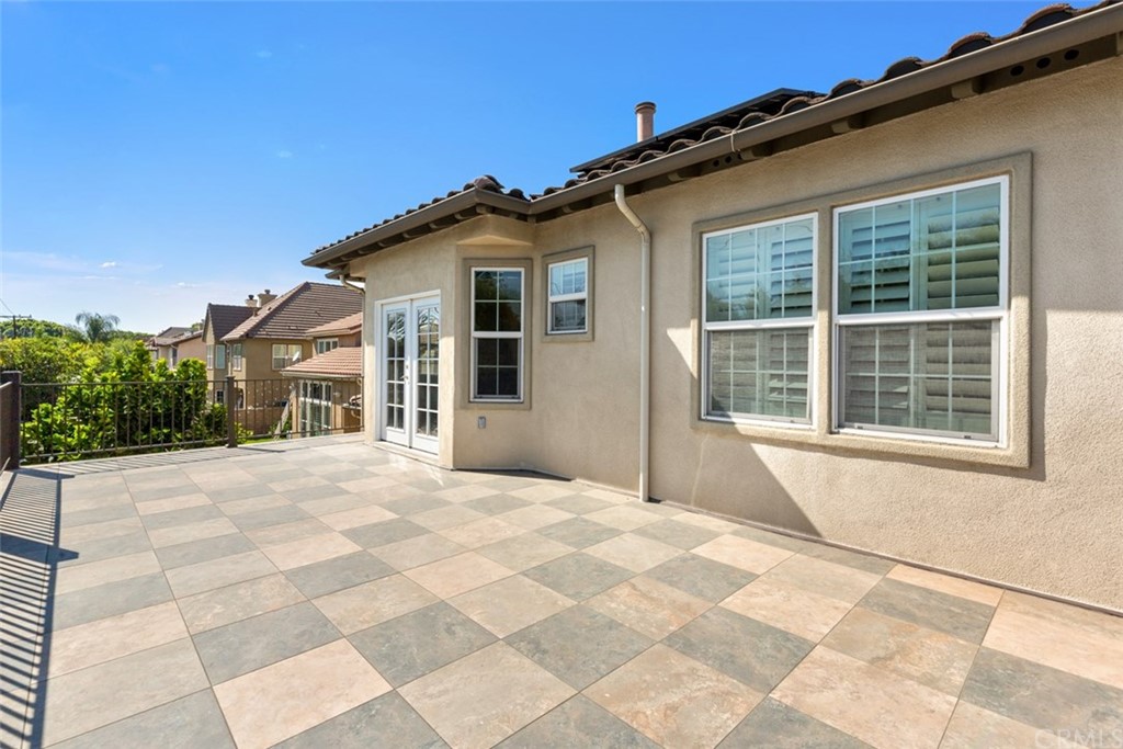 720 West Aster Place Santa Ana, CA 92706 - Photo 31 of 41 a view of house with backyard and trees in the background