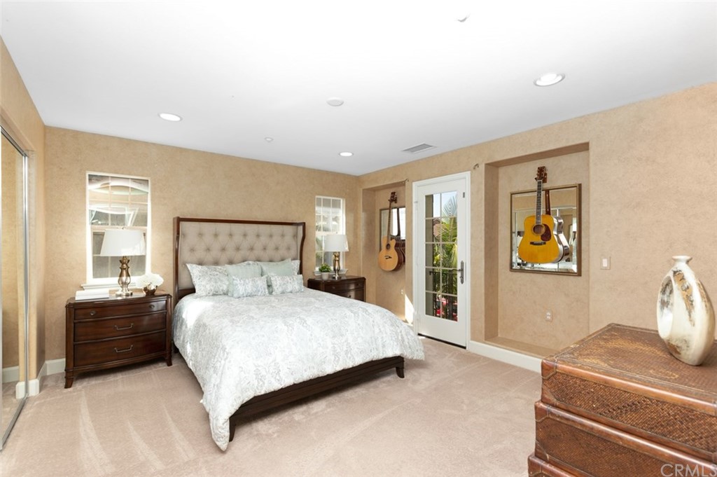 720 West Aster Place Santa Ana, CA 92706 - Photo 32 of 41 a bedroom with a large bed and a window